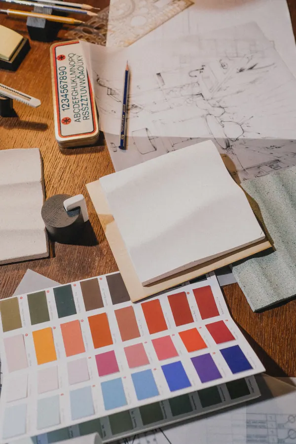 Illustration: colour swatches and sketches on a creative worktable