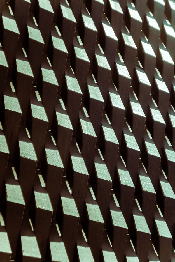 Illustration: geometric wooden blocks arranged in a structure