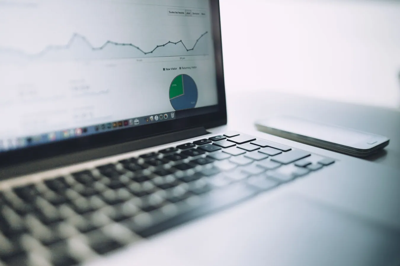 Illustration: analytics chart on a laptop and mobile device