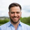 Professional portrait of Alex Greenland